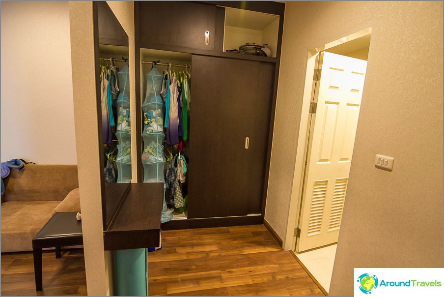 Closets with wardrobe and large mirror