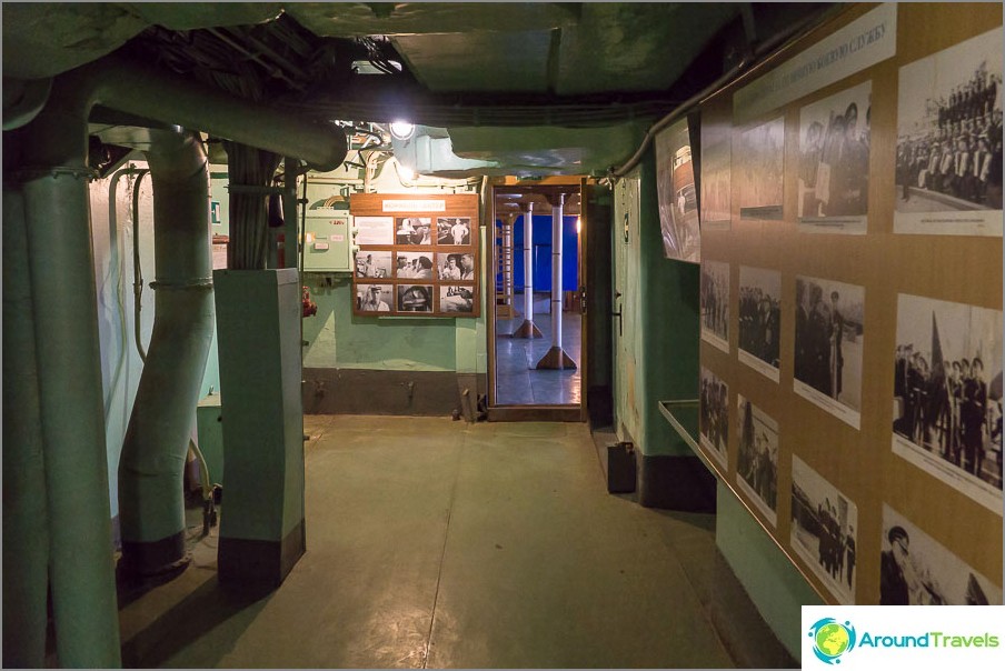 Before entering the cabin company stands with photos