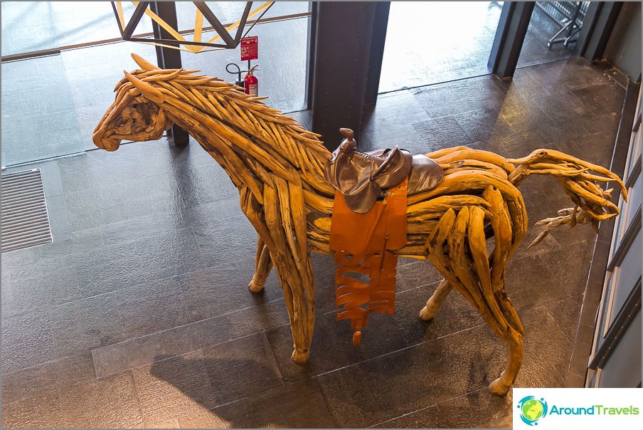 The horse is not wax and stands just in the shopping center, but I liked it very much