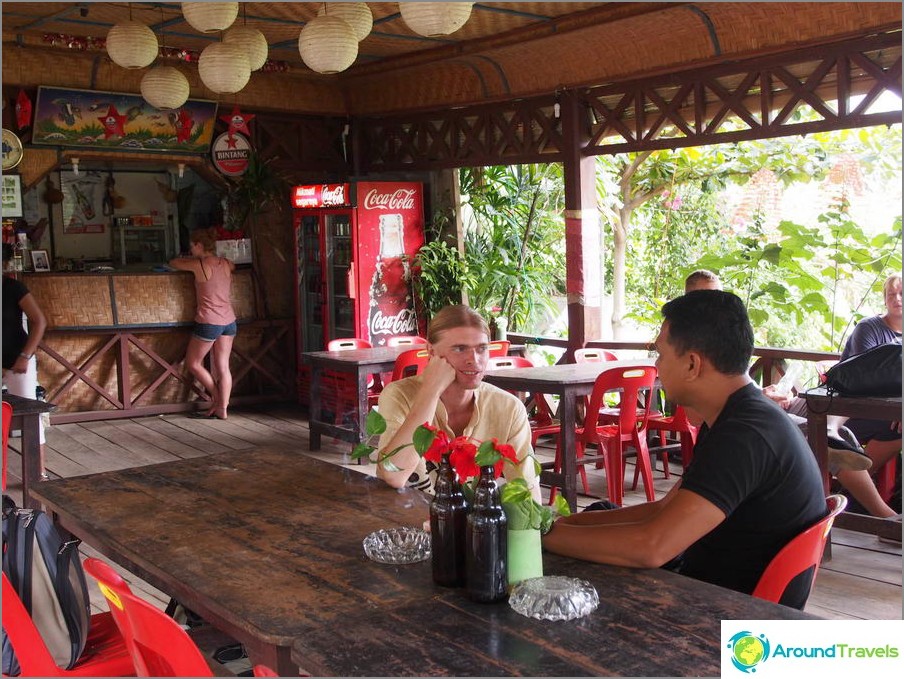 I negotiate with a local guide about trekking in Bukit Lavang