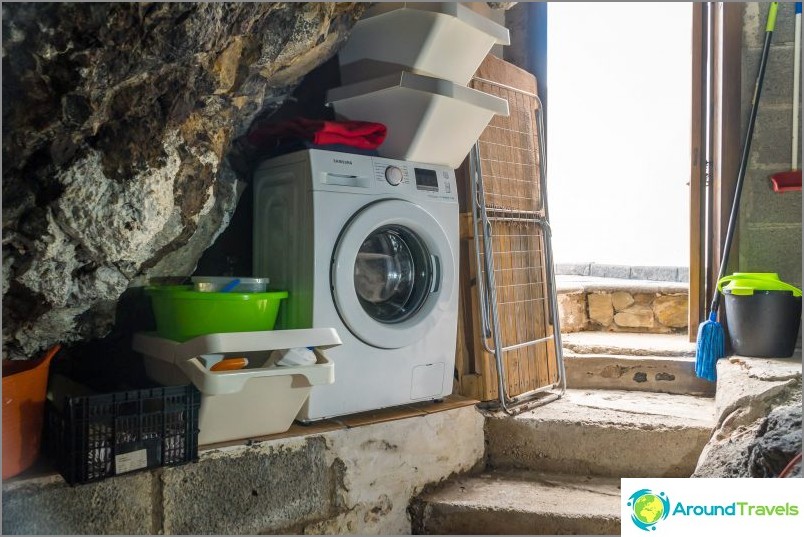 There is a washing machine in a separate cave.