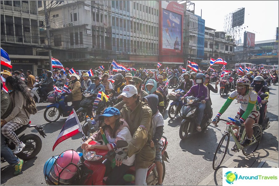 With children, on bikes and bicycles, with flags and smiles on their faces