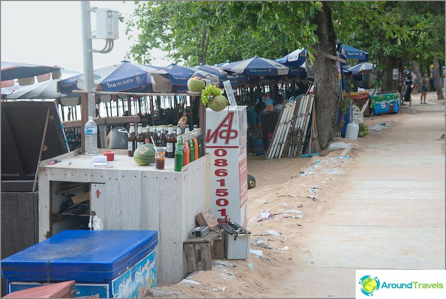 Drink trays between the beach and the pavement along the road