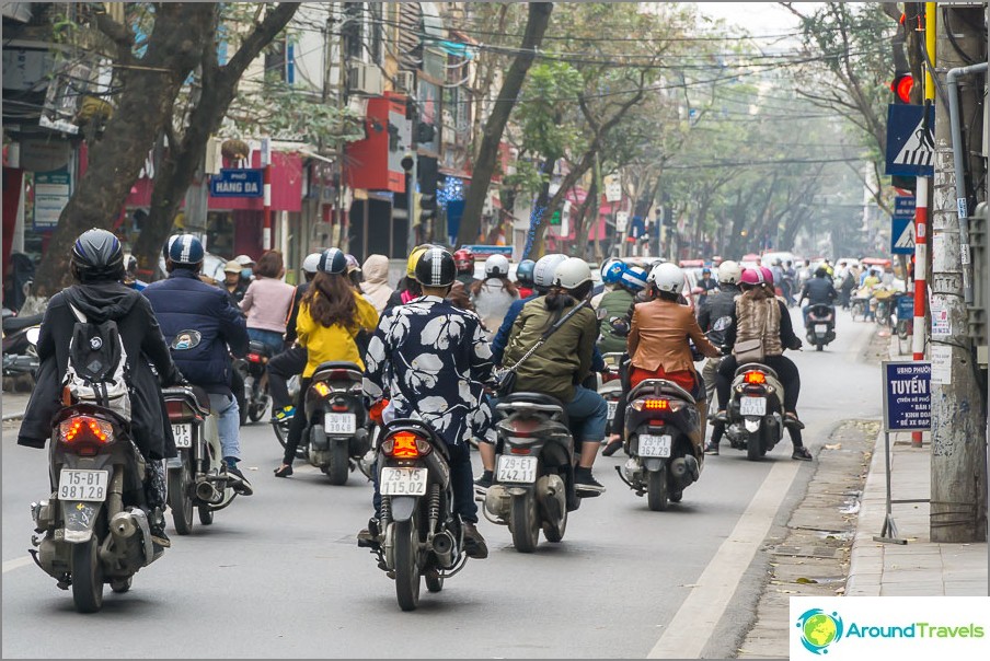 Splashy stream of bikes on the streets of Hanoi