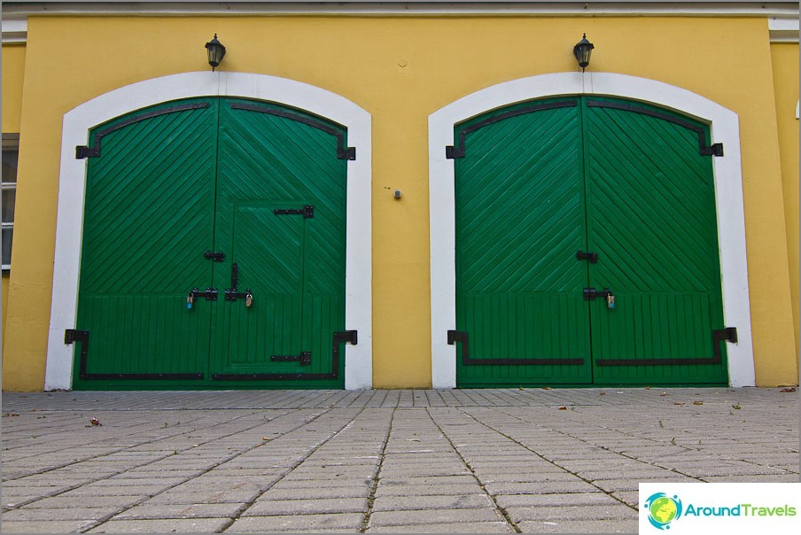 Bright green gate at the outbuilding