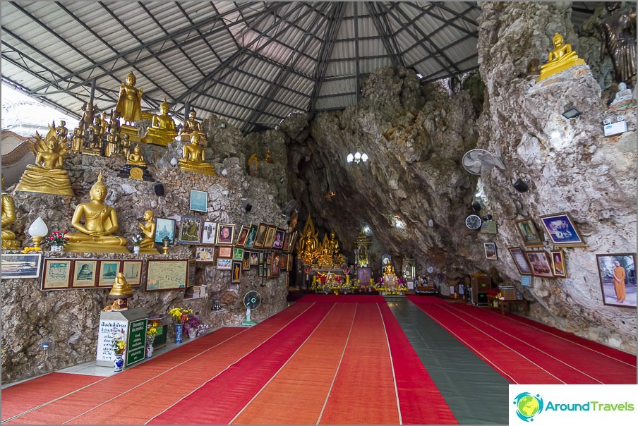 The temple is located inside the rock and covered with an artificial roof.
