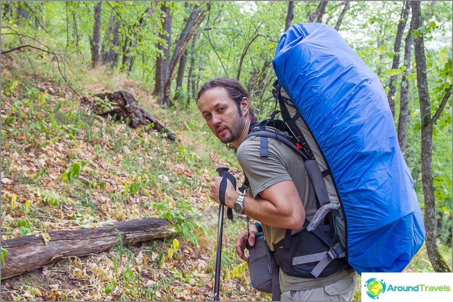 Hiking: a photo bag is hanging around your neck, the rest is inside a hiking backpack