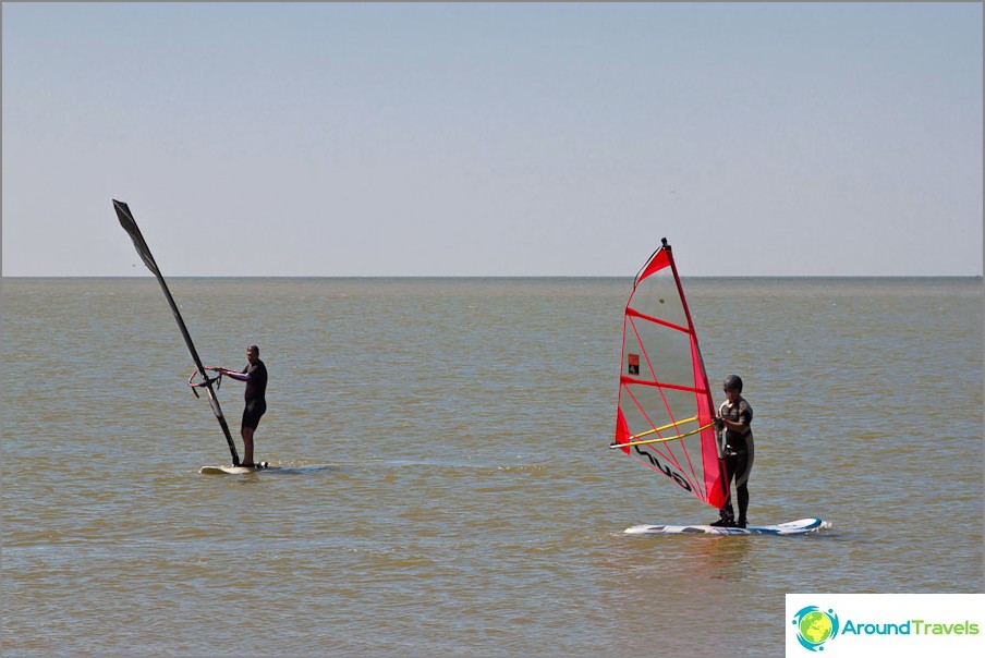 Surfers on Dolzhanskaya Spit Surfers on Dolzhanskaya Spit