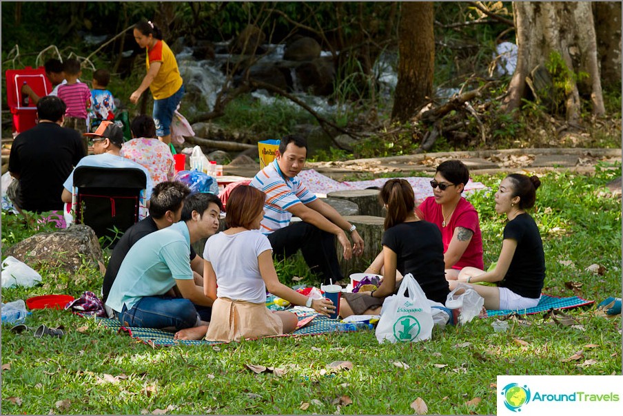 Thai families sit in circles